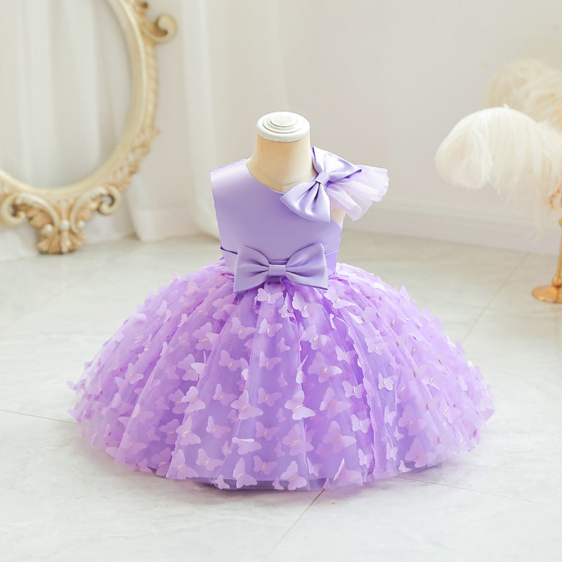 Vestido infantil en colores vibrantes con tul y lazos, ideal para celebraciones y ocasiones especiales.