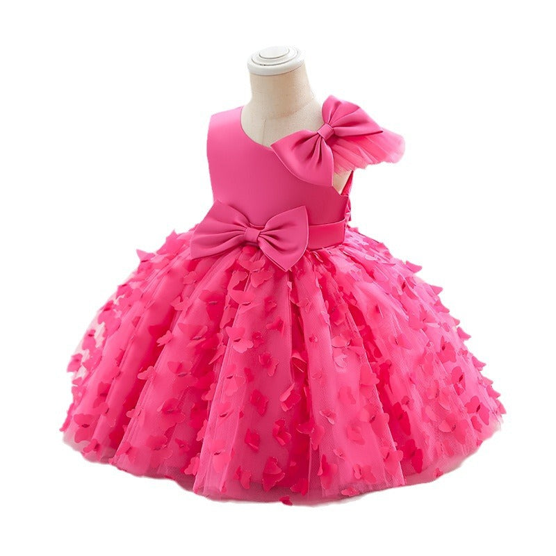 Vestido infantil de princesa en color púrpura con detalles en tul y moño, ideal para fiestas y celebraciones.Vestido infantil de princesa – Tul fiesta niña