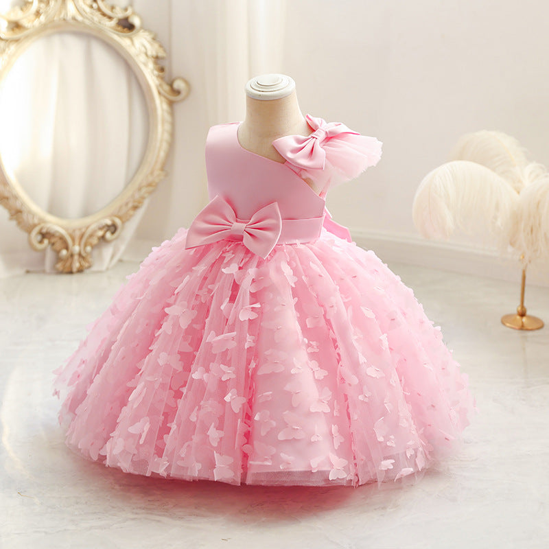 Vestido infantil de princesa en color púrpura con detalles en tul y moño, ideal para fiestas y celebraciones.Vestido infantil de princesa – Tul fiesta niña