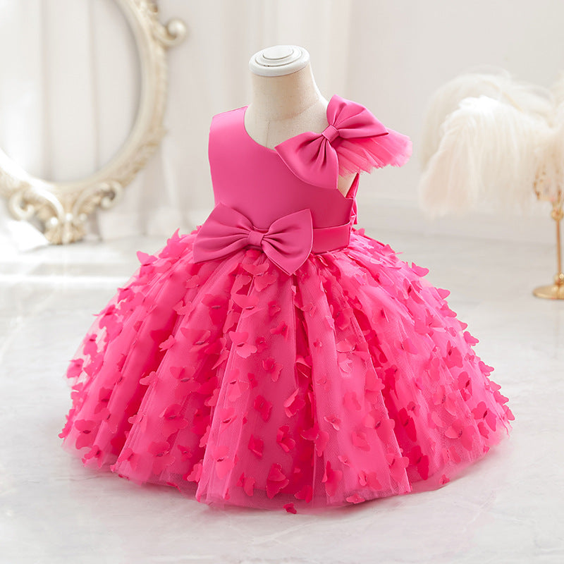 Vestido infantil de princesa en color púrpura con detalles en tul y moño, ideal para fiestas y celebraciones.Vestido infantil de princesa – Tul fiesta niña