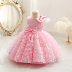 Vestido infantil de princesa en color púrpura con detalles en tul y moño, ideal para fiestas y celebraciones.Vestido infantil de princesa – Tul fiesta niña